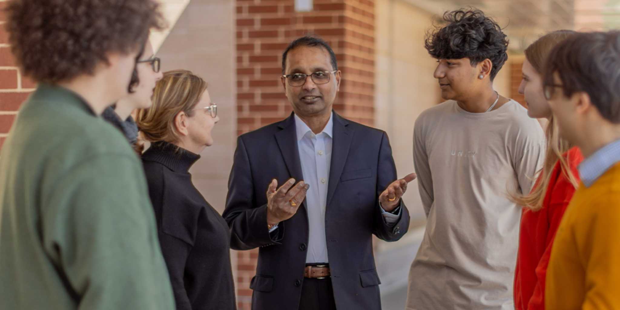 Kannan Srinivasan talking to a group of constituents